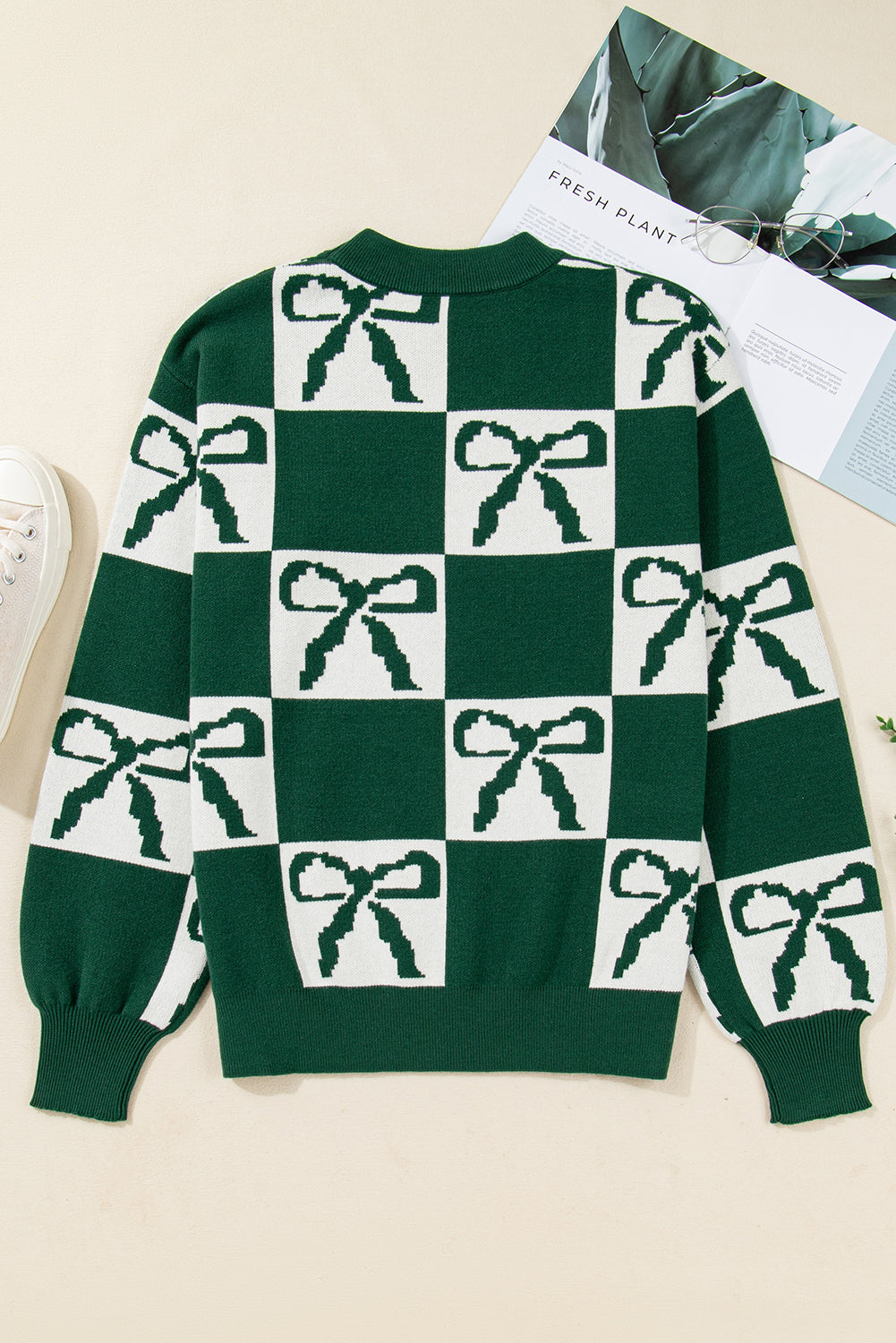 Pull en maille à carreaux vert noirâtre avec nœuds imprimés