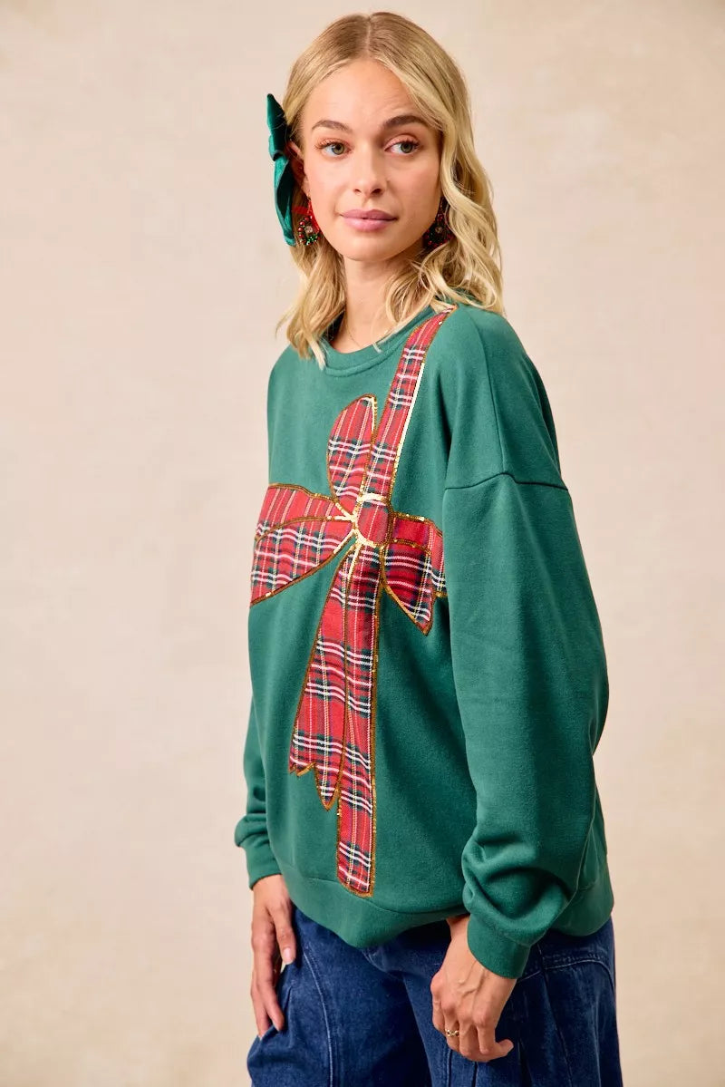 Pull en polaire de Noël BiBi avec nœud en ruban écossais