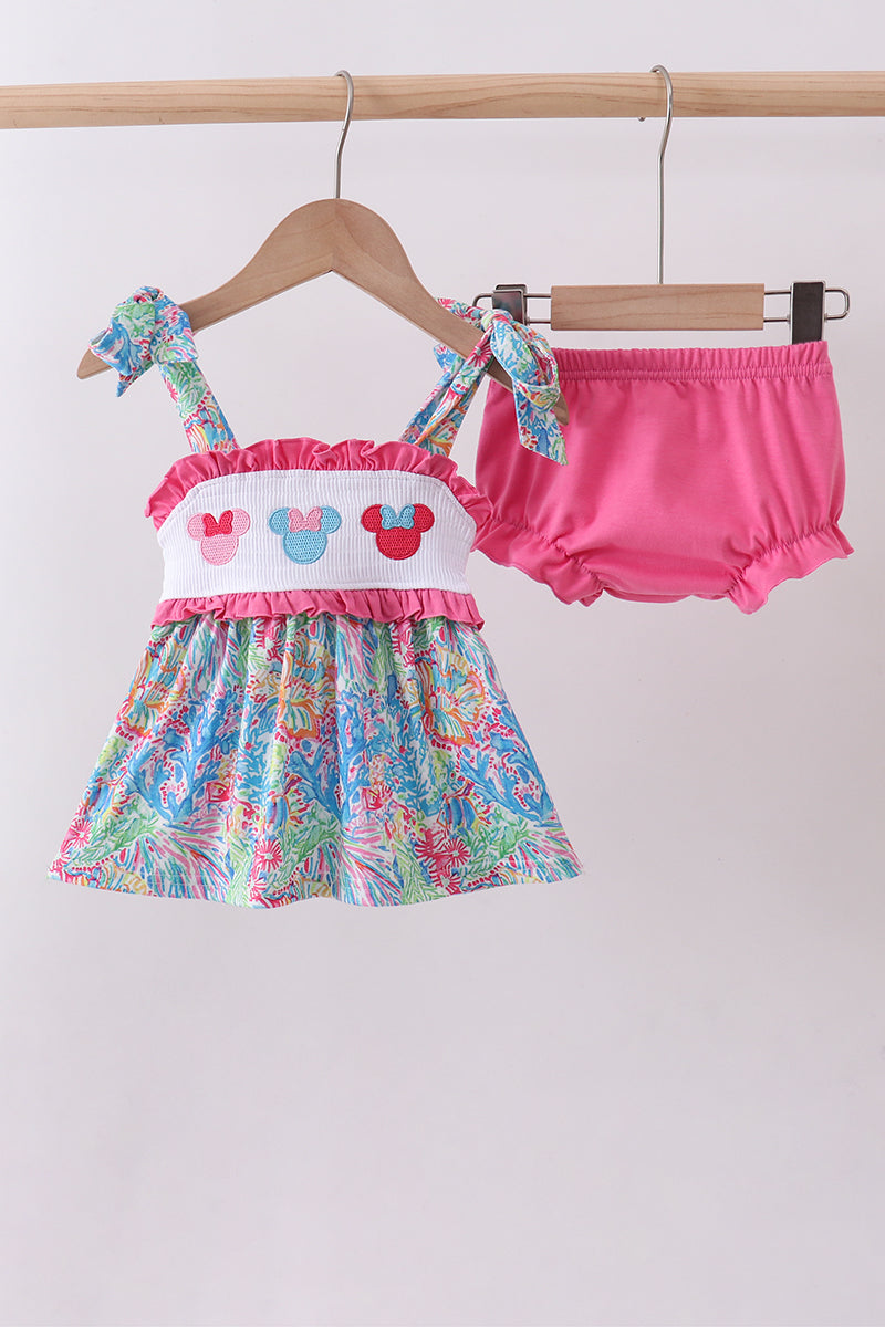 Ensemble barboteuse à smocks et volants, personnage rose