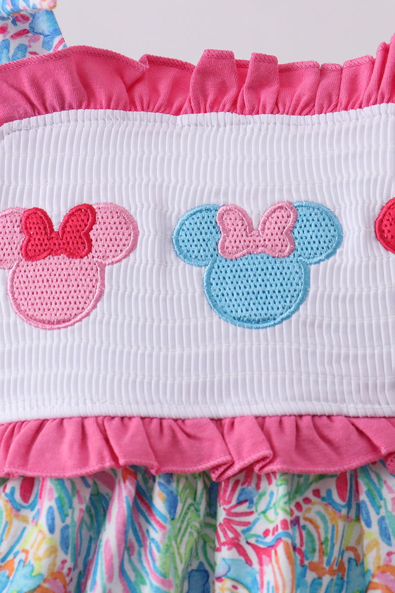 Ensemble barboteuse à smocks et volants, personnage rose