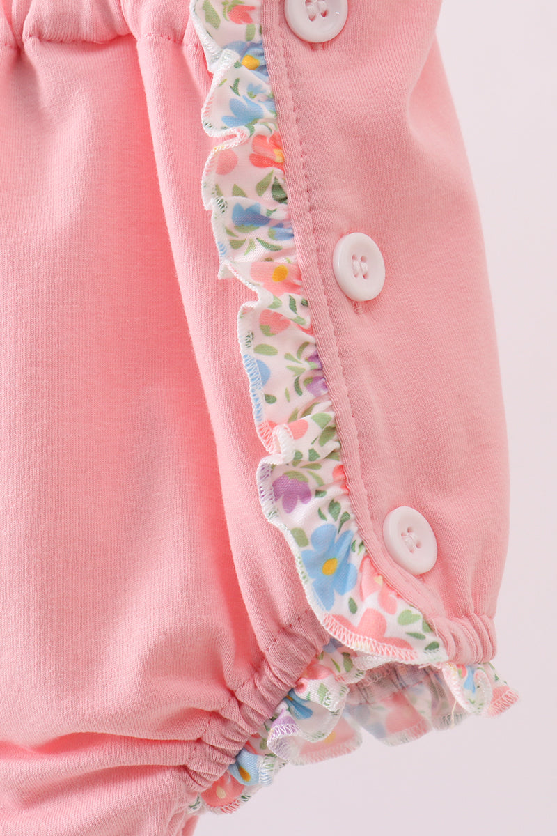 Combinaison bouffante rose à volants brodée de fleurs