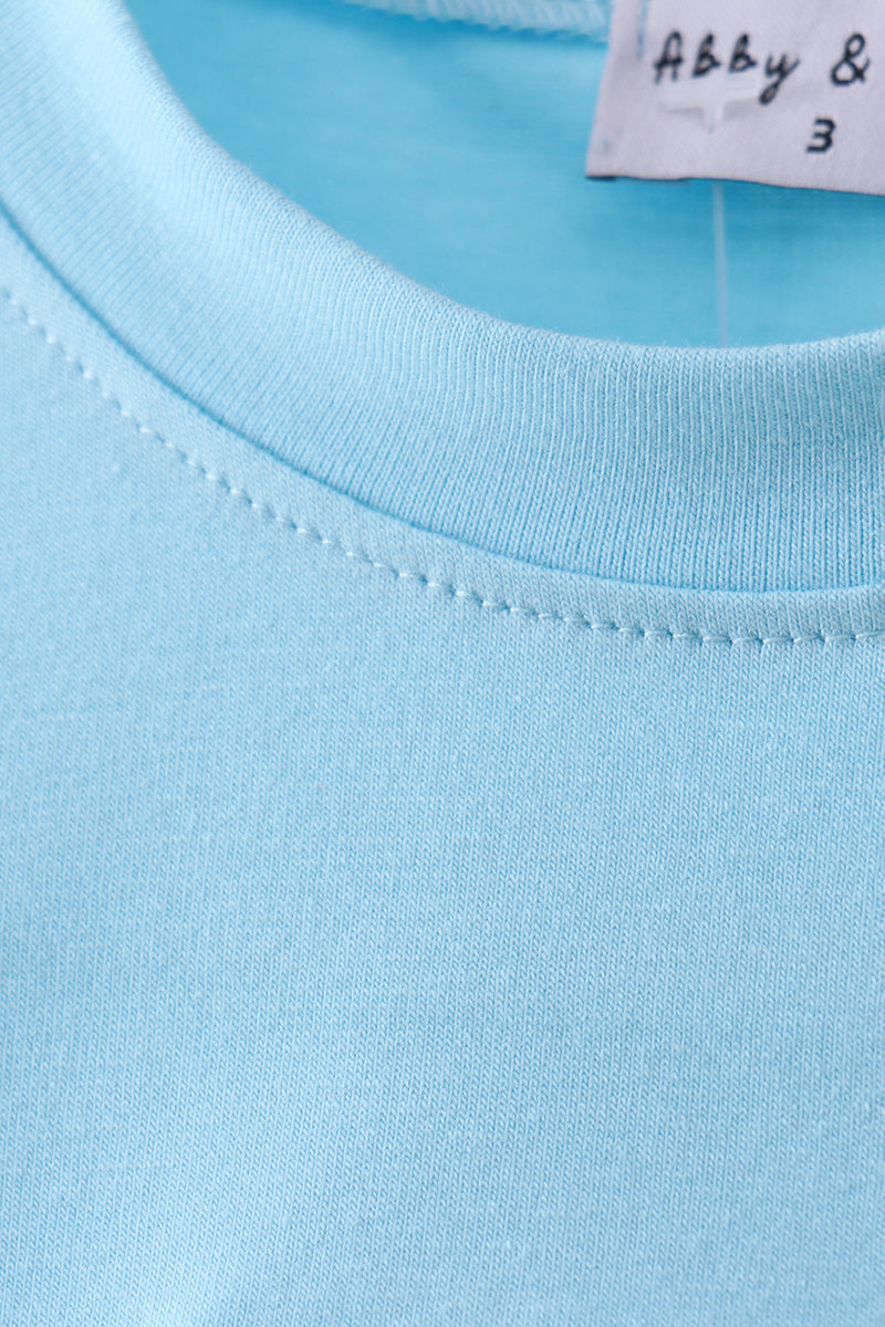 Haut avec applique croix bleue