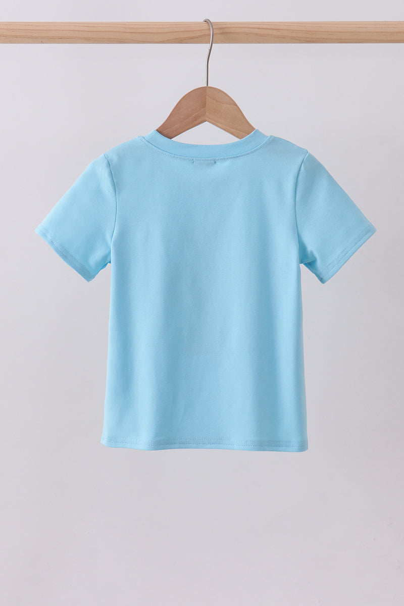 Haut avec applique croix bleue