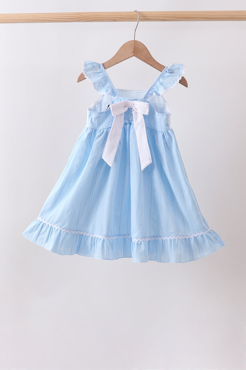 Robe jacquard smockée et brodée à nœud bleu