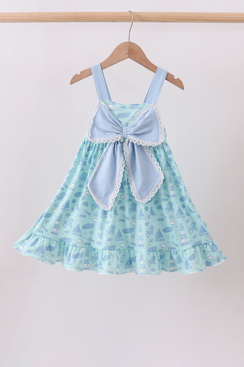 Robe à volants et nœud imprimé plage bleue