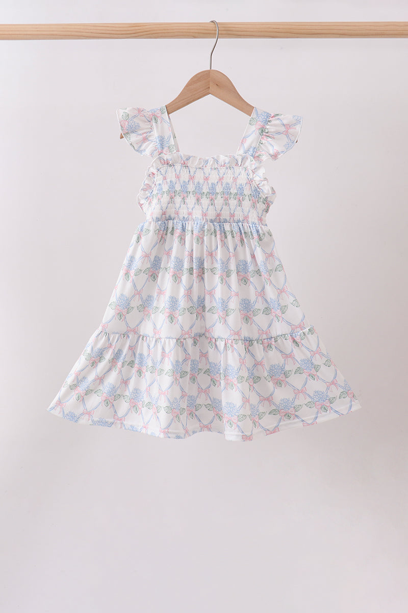 Robe bleue fleurie à volants