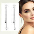 Boucles d'oreilles pendantes longues perles et billes or 18 carats