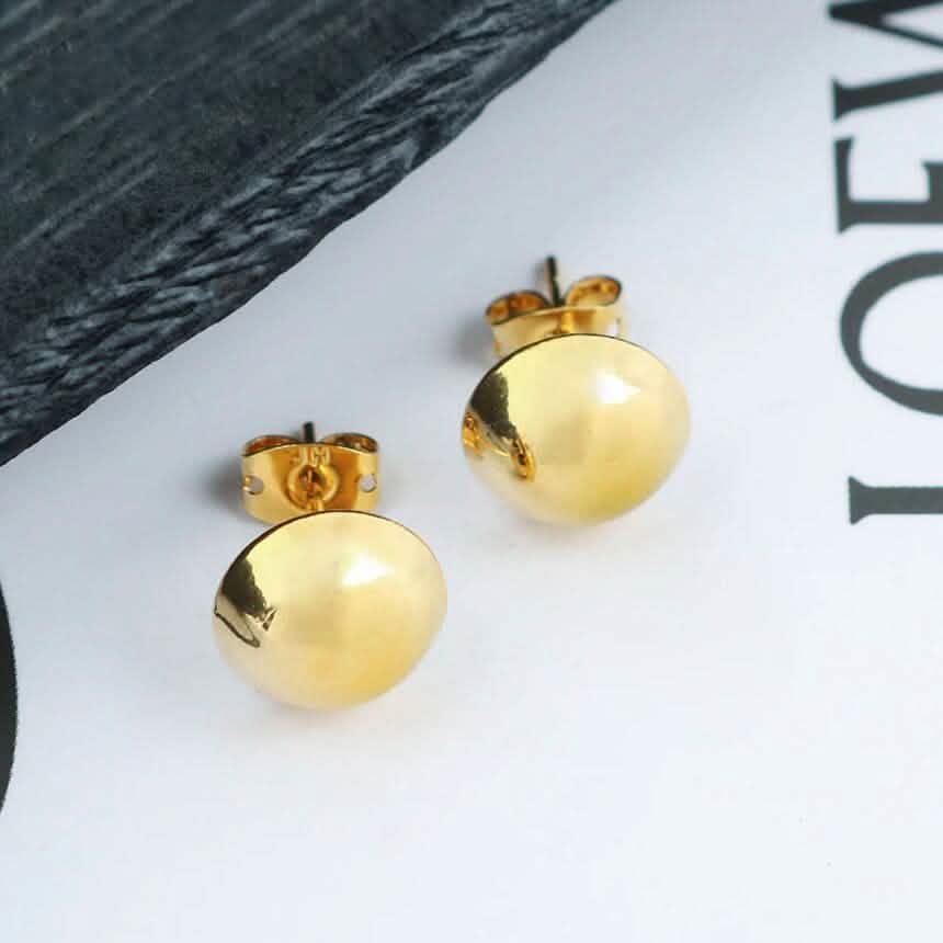 Clous d'oreilles demi-boule en or 18 carats