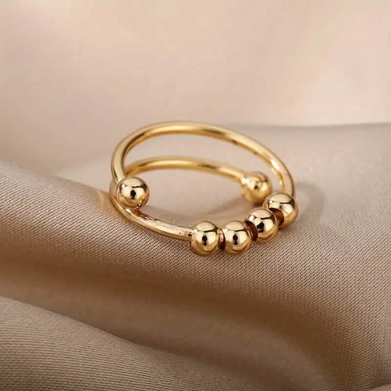 Bague anti-stress en or 18 carats avec perles tournantes