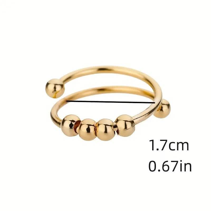 Bague anti-stress en or 18 carats avec perles tournantes