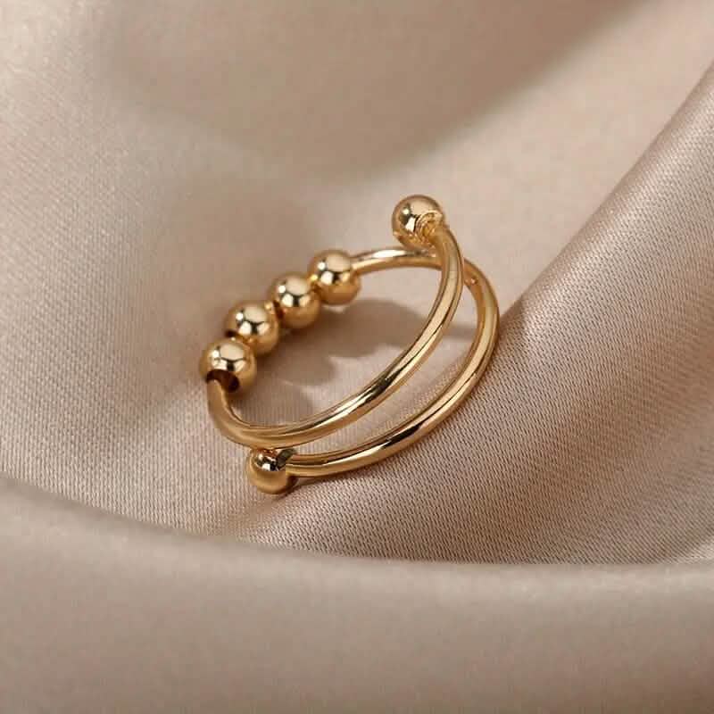 Bague anti-stress en or 18 carats avec perles tournantes