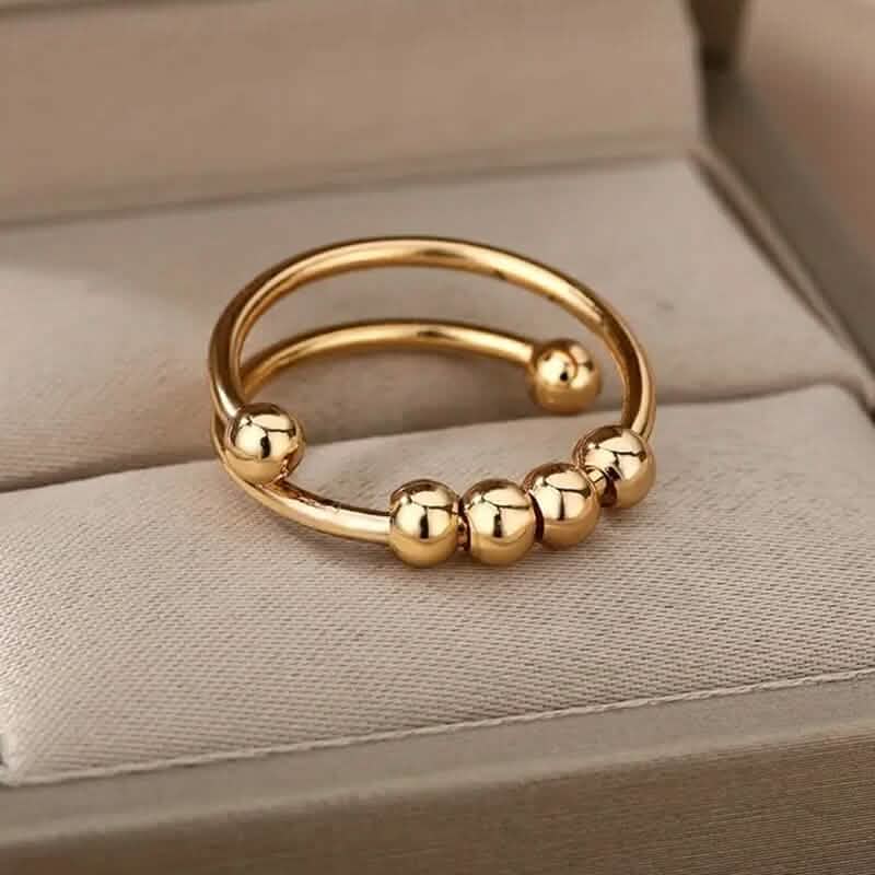 Bague anti-stress en or 18 carats avec perles tournantes