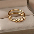 Bague anti-stress en or 18 carats avec perles tournantes