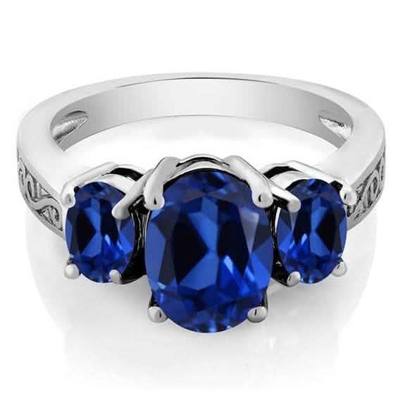 Bague en plaqué or blanc 18 carats avec trois pierres taille ovale