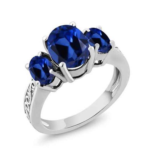 Bague en plaqué or blanc 18 carats avec trois pierres taille ovale