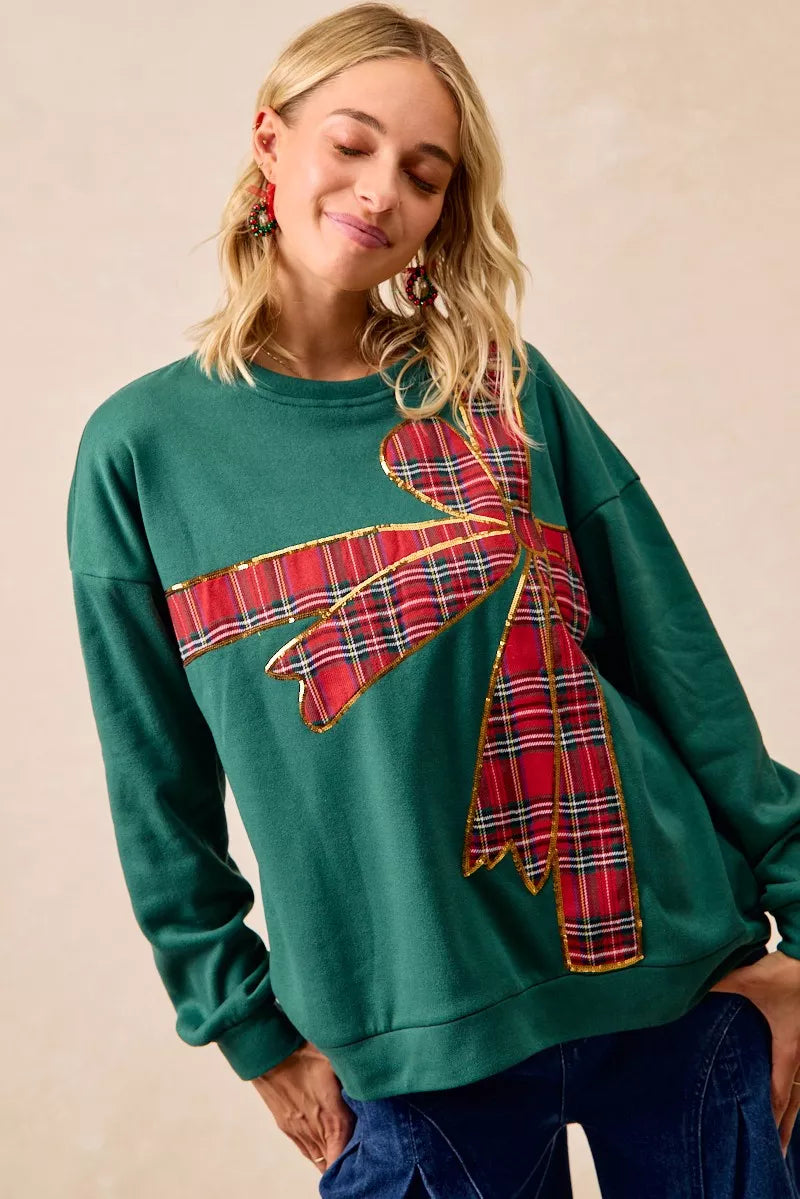 Pull en polaire de Noël BiBi avec nœud en ruban écossais