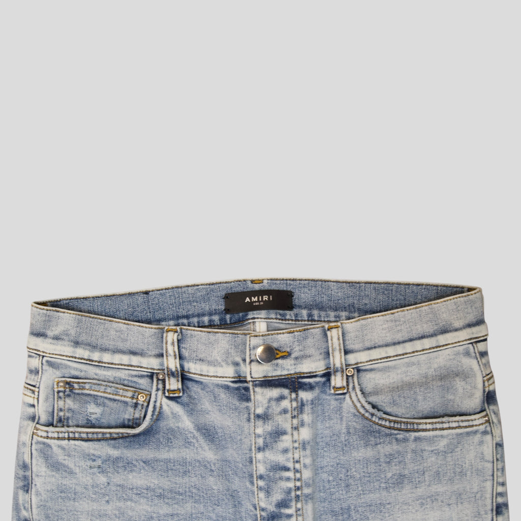 Jean Amiri MX1 en cuir et denim stone indigo
