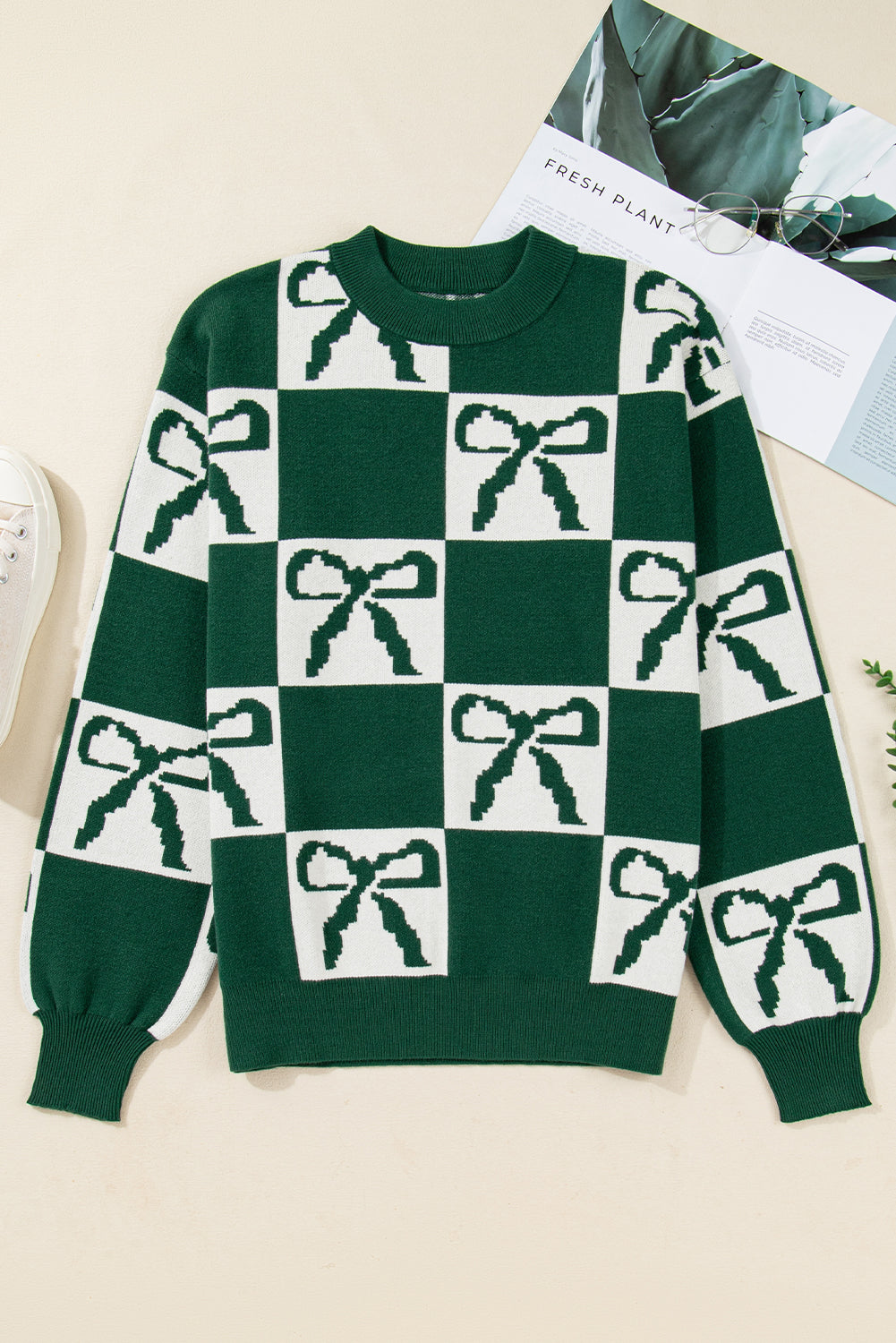 Pull en maille à carreaux vert noirâtre avec nœuds imprimés