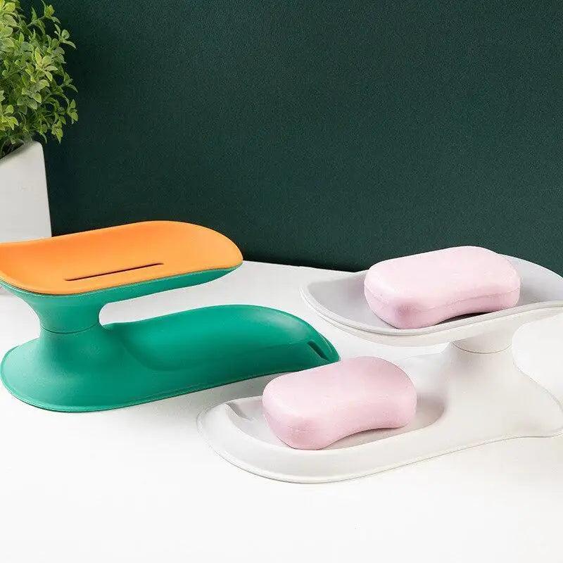 1 Pcs Porte-savon égouttoir en forme de robinet Produits de salle de bain portables Double couche 3 couleurs Boîte à savon écologique Porte-savon égouttoir Support éponge Récipient à savon avec bec verseur pour salle de bain douche évier de cuisine