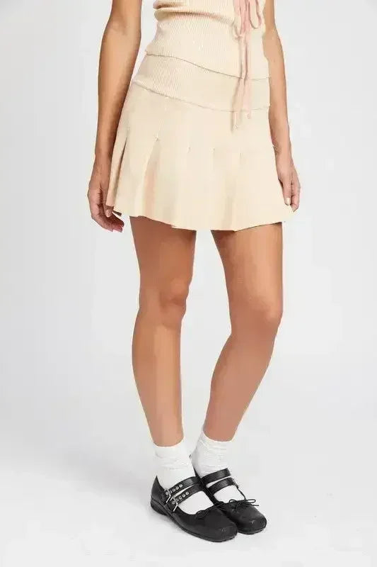 JUPE COURTE PLISSÉE TAILLE BASSE