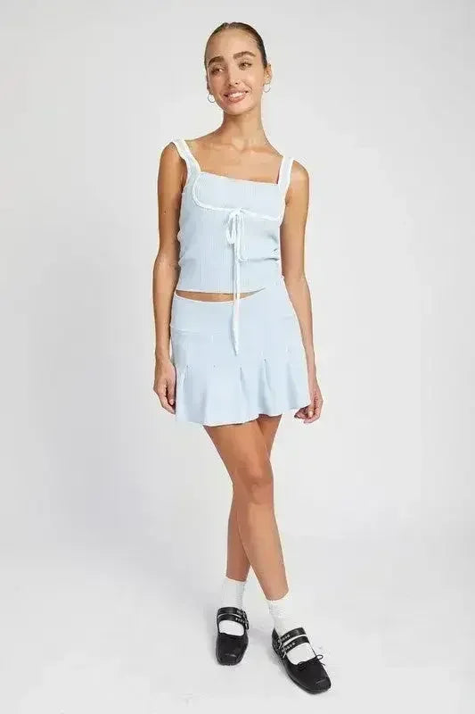 JUPE COURTE PLISSÉE TAILLE BASSE