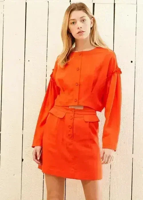 Haut court à manches longues boutonnée pour femme, coloris coquelicot