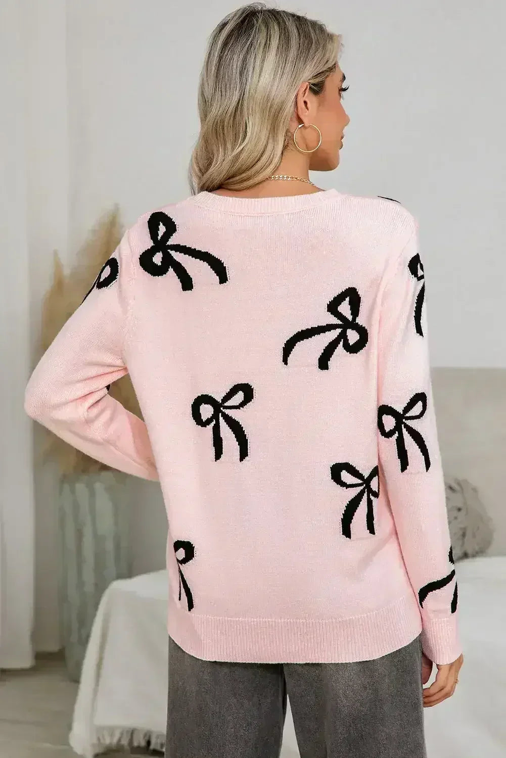 Pull ample à manches longues imprimé de nœuds rose clair