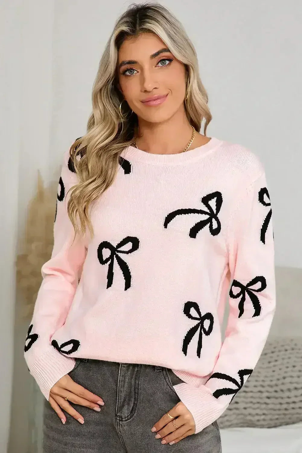 Pull ample à manches longues imprimé de nœuds rose clair