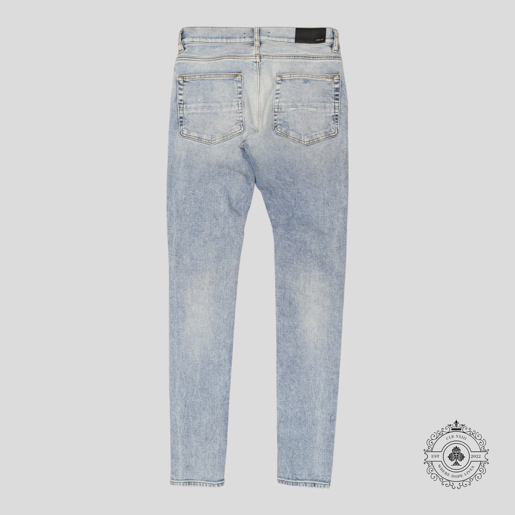 Jean Amiri MX1 en cuir et denim stone indigo