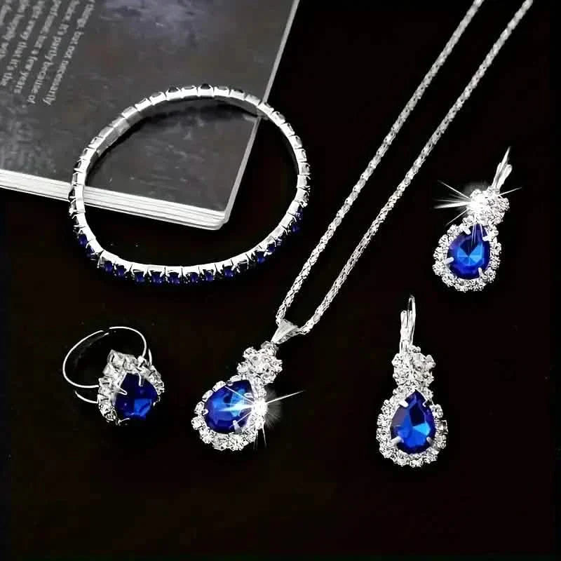 Ensemble 5 pièces : Parure de bijoux élégante pour femme, comprenant une paire de boucles d'oreilles, un collier, une bague et un bracelet ornés d'éléments en verre