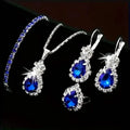 Ensemble 5 pièces : Parure de bijoux élégante pour femme, comprenant une paire de boucles d'oreilles, un collier, une bague et un bracelet ornés d'éléments en verre