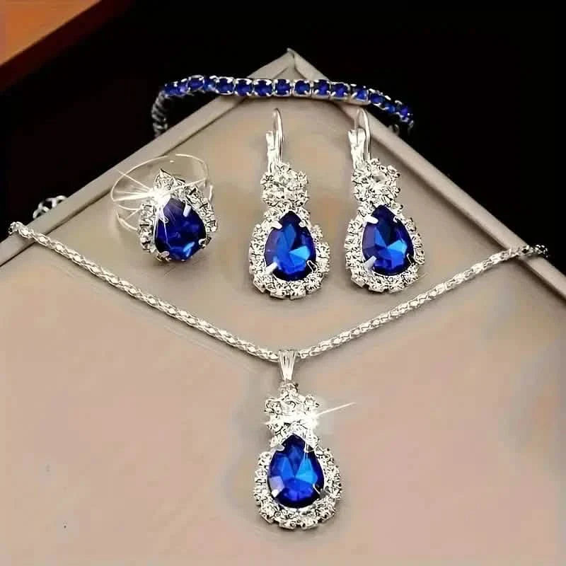Ensemble 5 pièces : Parure de bijoux élégante pour femme, comprenant une paire de boucles d'oreilles, un collier, une bague et un bracelet ornés d'éléments en verre