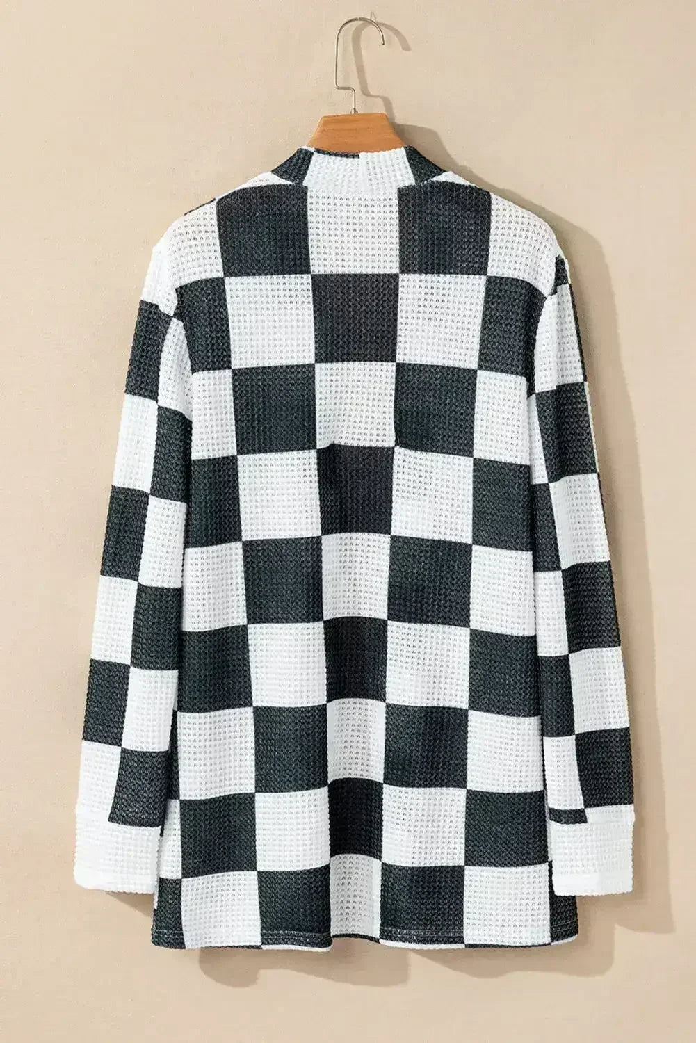 Cardigan ouvert en maille gaufrée à carreaux noirs avec trous pour les pouces