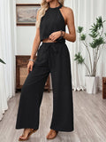 Ensemble deux pièces caraco court à col américain et pantalon large pour femme
