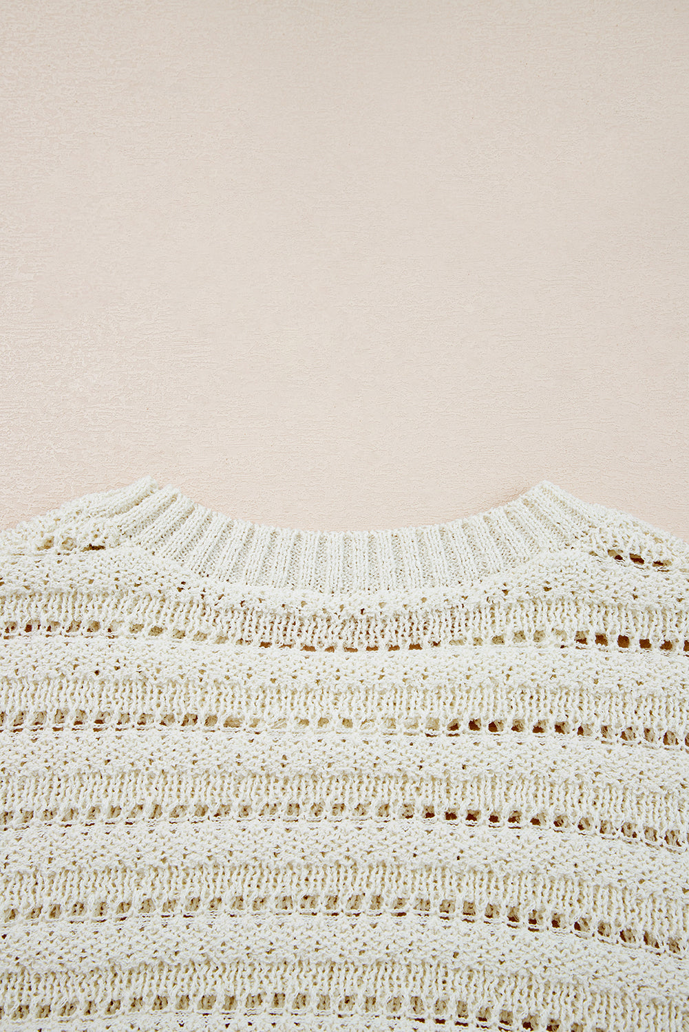 Pull en maille ajourée blanche à col rond