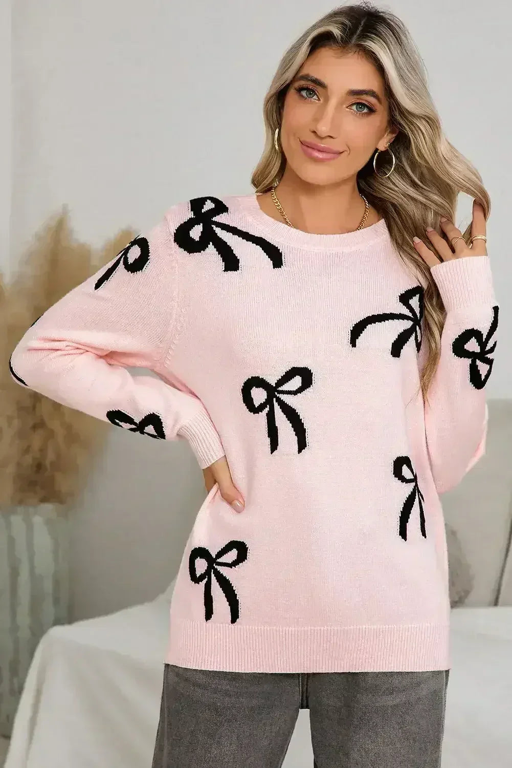 Pull ample à manches longues imprimé de nœuds rose clair