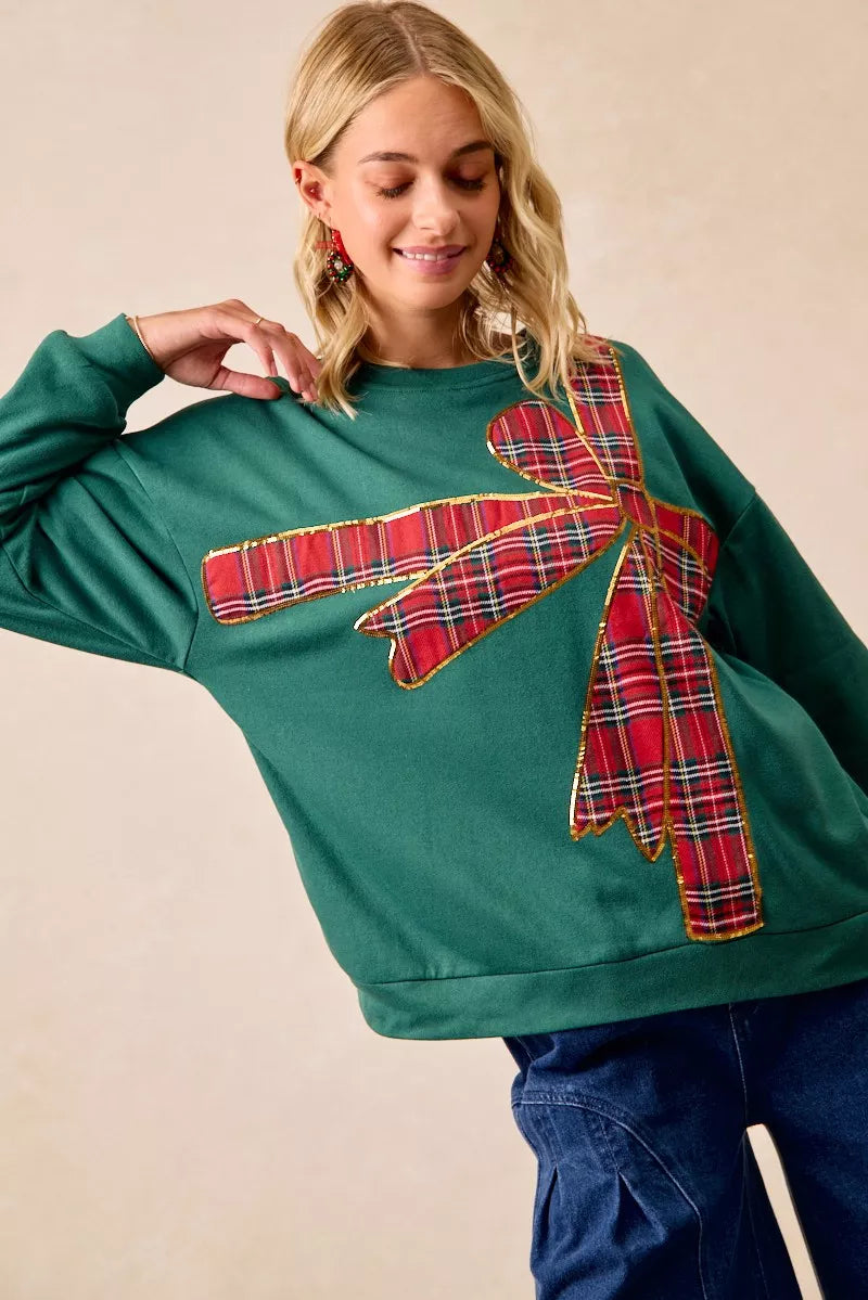 Pull en polaire de Noël BiBi avec nœud en ruban écossais