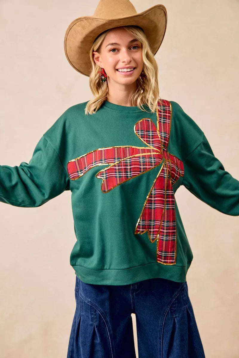 Pull en polaire de Noël BiBi avec nœud en ruban écossais