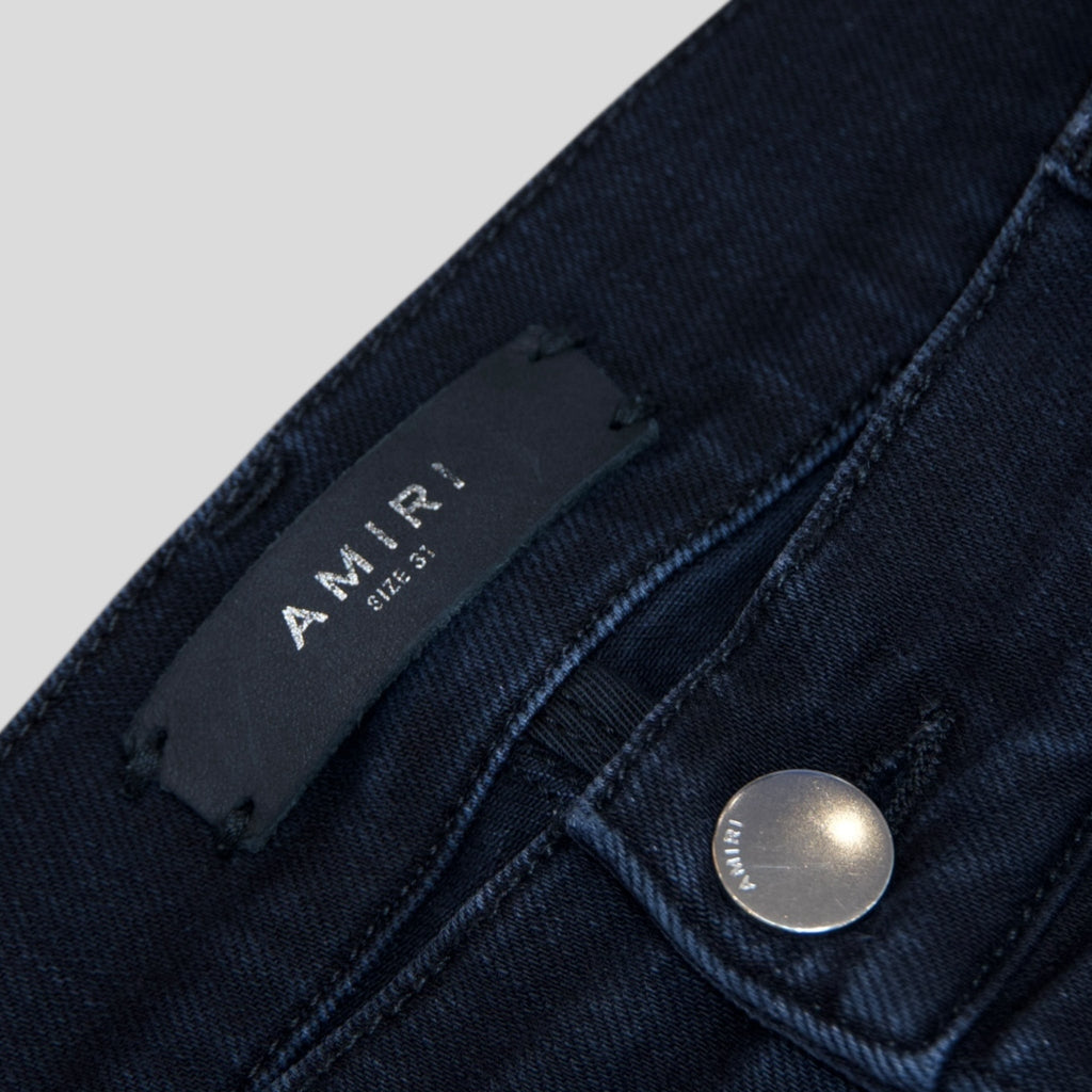Jean Amiri MX1 Thrashed en denim noir vieilli