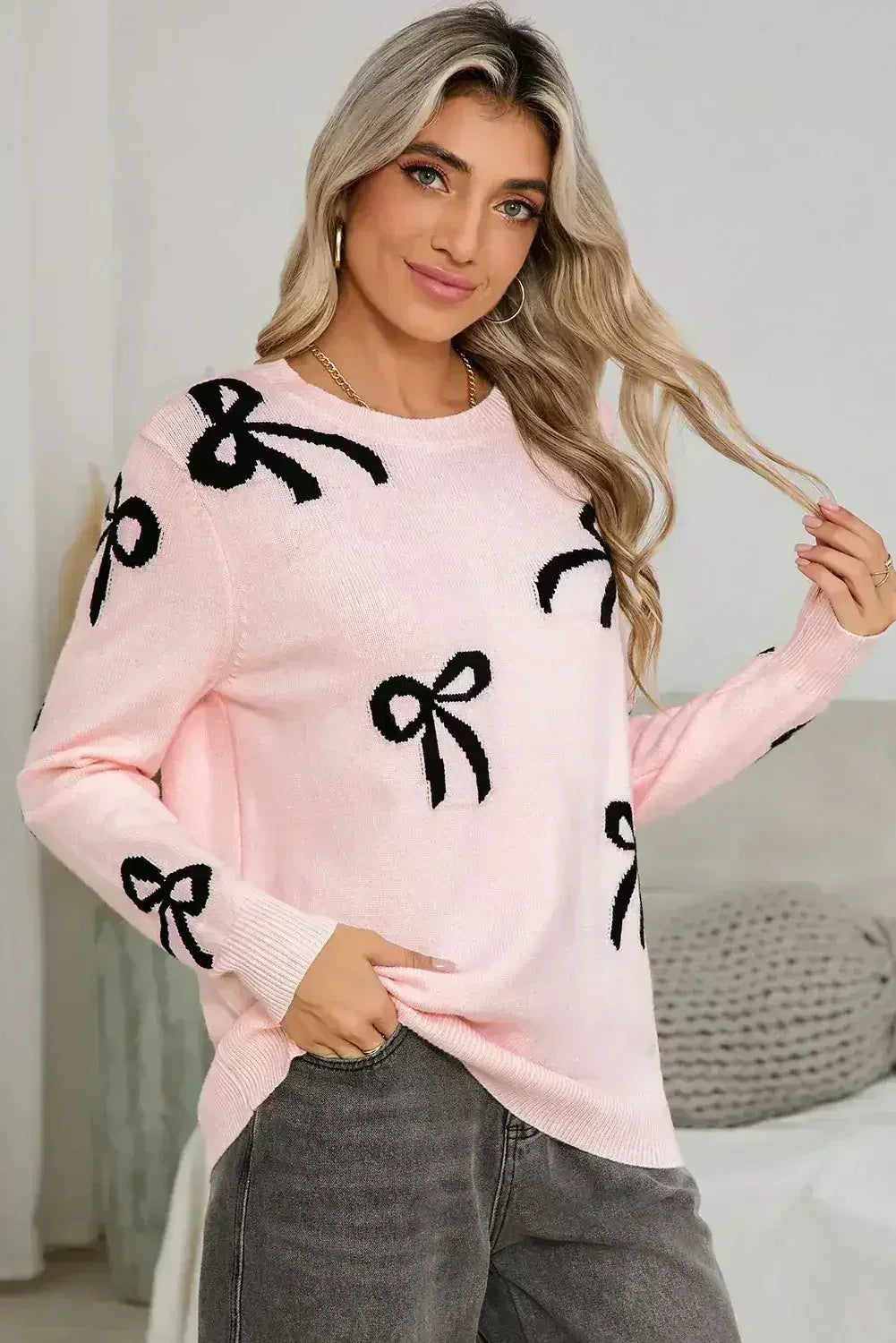 Pull ample à manches longues imprimé de nœuds rose clair