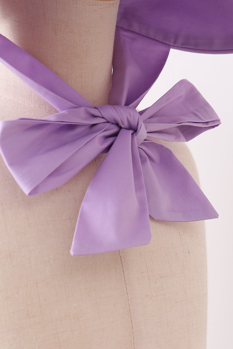 Bonnet violet à volants et nœud