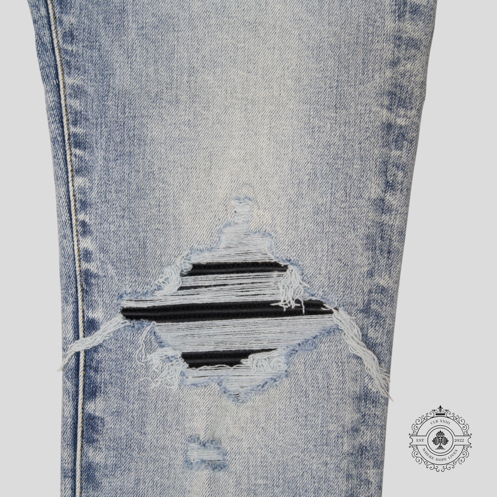 Jean Amiri MX1 en cuir et denim stone indigo