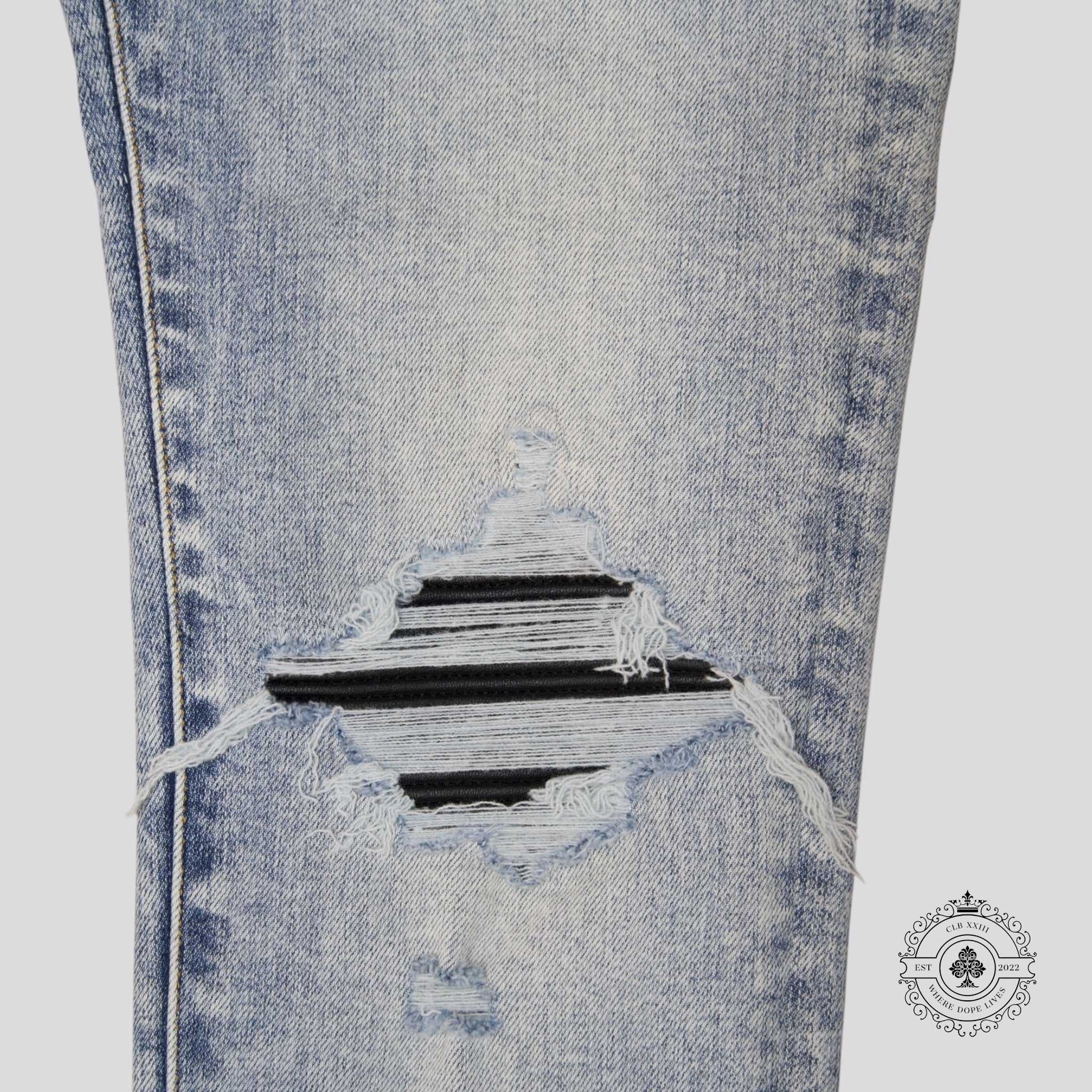 Jean Amiri MX1 en cuir et denim stone indigo