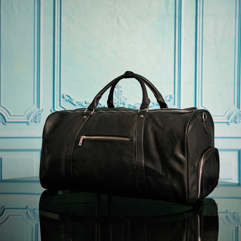 Ensemble de sacs Signature en cuir noir (Sac à dos Signature et Sac de voyage)