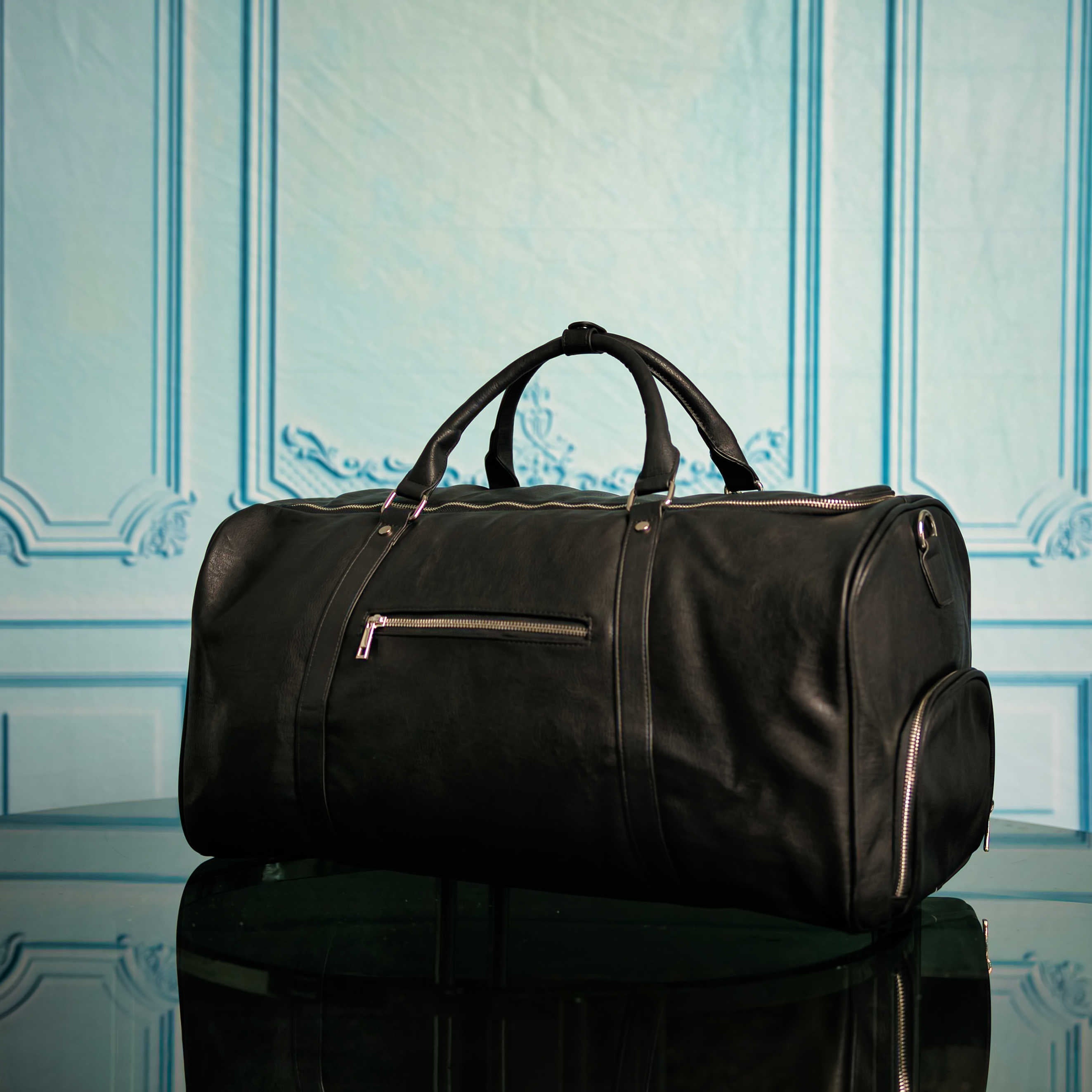 Ensemble de sacs Signature en cuir noir (Sac à dos Signature et Sac de voyage)