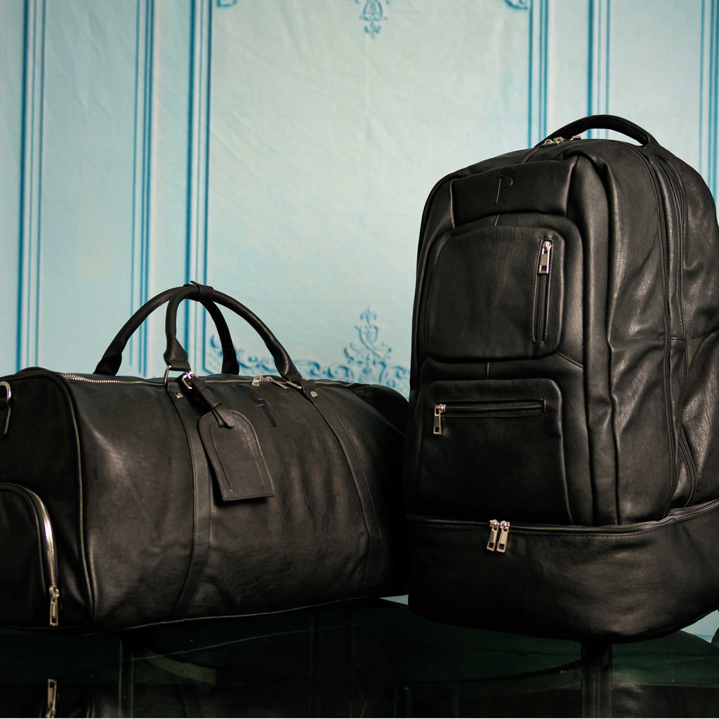 Ensemble de sacs Signature en cuir noir (Sac à dos Signature et Sac de voyage)