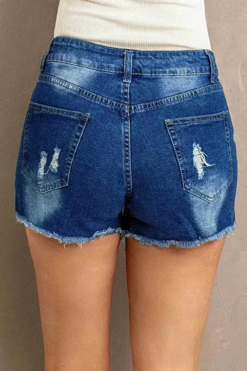 Shorts en jean déchirés avec dentelle