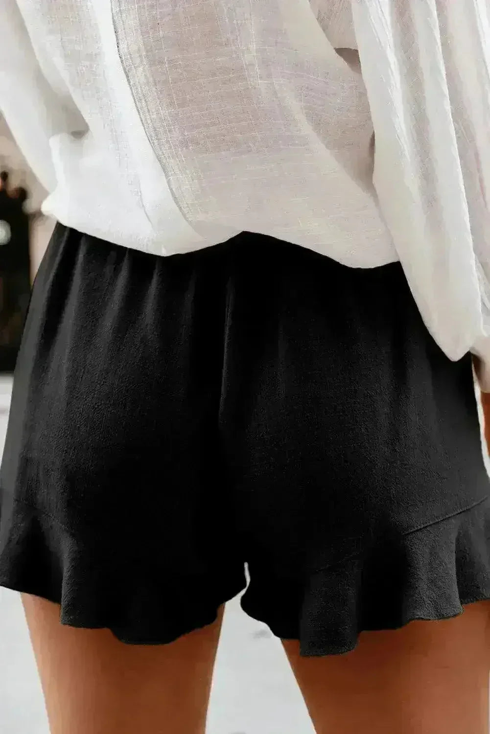 Shorts décontractés en lin et coton noirs à volants avec poches