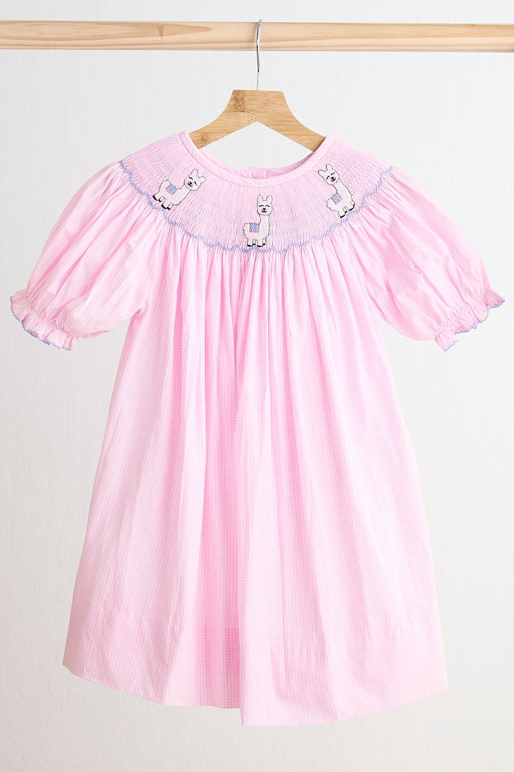 Robe vichy rose en alpaga smockée à la main