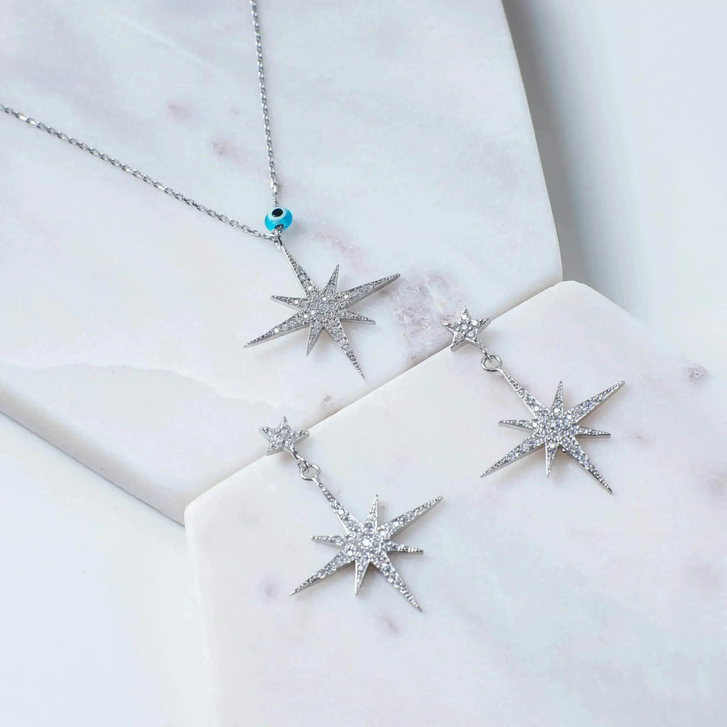 Boucles d'oreilles pendantes Petite Star Burst | Bijoux célestes en argent - Femstylo